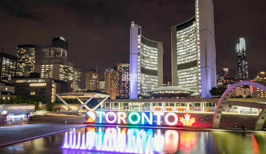 Toronto's cityscape lights up at night, showcasing the vibrant atmosphere of Toronto spring festivals in 2025 and the city's lively cultural scene.