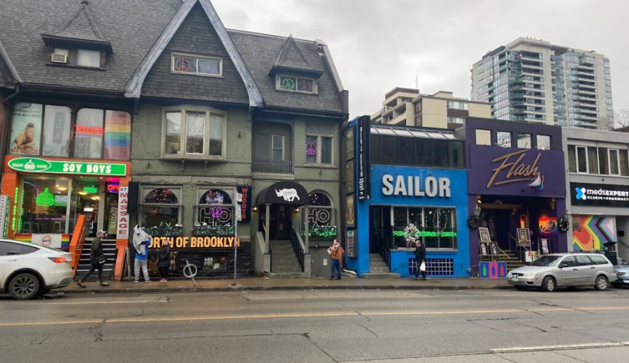 A snapshot of Toronto’s iconic Church-Wellesley Village, home to some of the city’s most beloved queer-owned Toronto spots like Woody’s, Sailor, and Flash. This vibrant strip is the heart of the LGBTQ2S+ community—where nightlife, activism, and celebration meet year-round, especially during Pride.