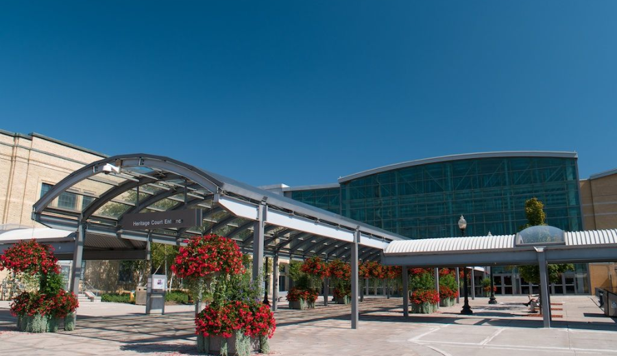 Front entrance of the Enercare Centre in Toronto, the official venue for VCT Toronto 2025, with clear blue skies and floral displays