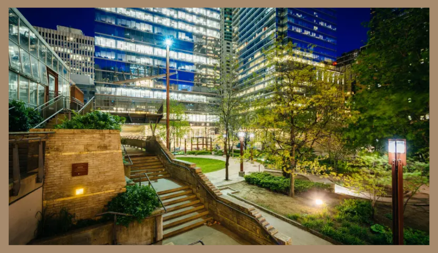 Cloud Gardens at night, a hidden green space in Toronto’s Financial District with modern architecture and trees