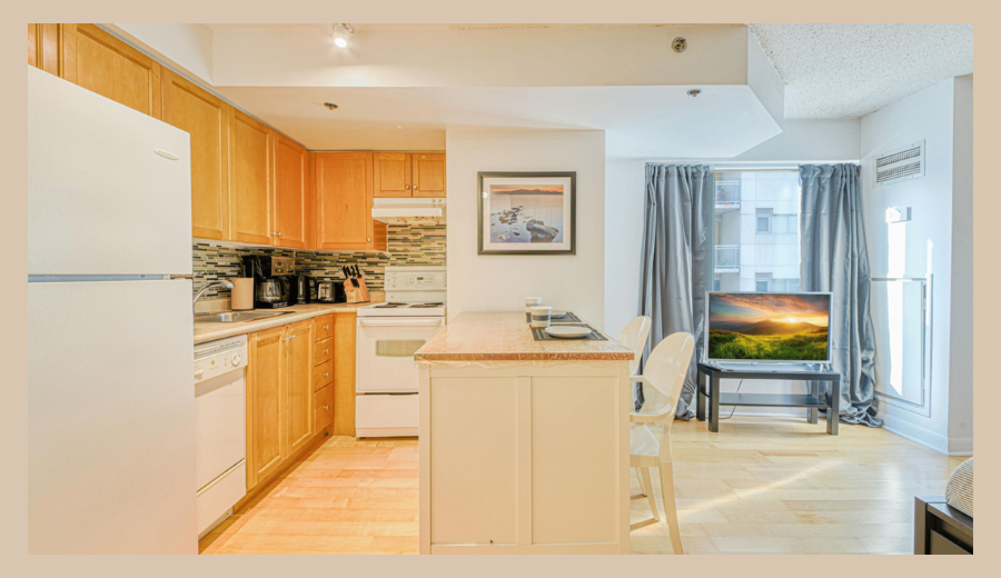 Modern economy suite at Rivet Stays in Toronto featuring a full kitchen, bright natural light, and cozy seating — perfect for relaxing before or after your nautical hideaway near Toronto.
