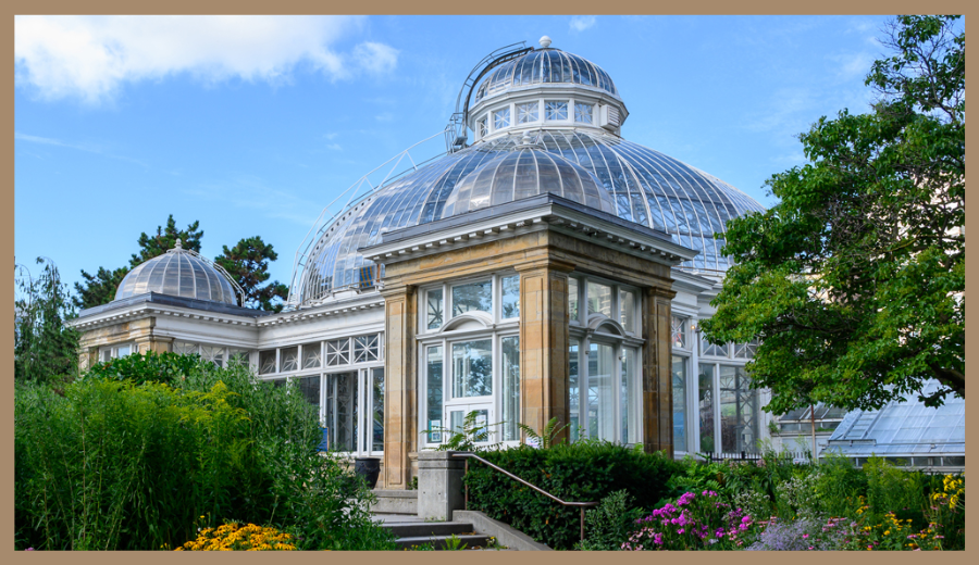 Toronto hidden gem botanical garden at Allan Gardens with domed glass greenhouse and colorful flowers