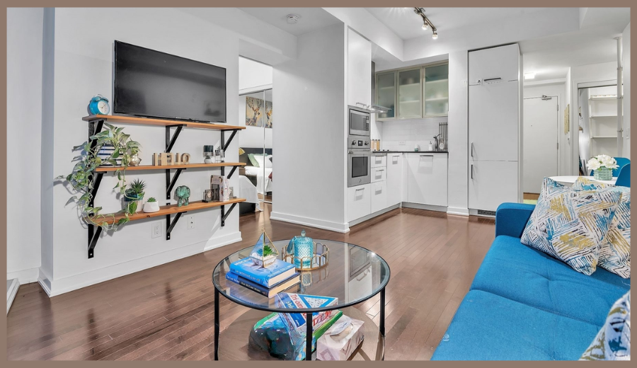 Modern RivetStays Toronto suite with open living room, kitchen, and cozy sofa – perfect stay after the Cardi B Toronto concert.