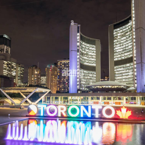Toronto's cityscape lights up at night, showcasing the vibrant atmosphere of Toronto spring festivals in 2025 and the city's lively cultural scene.
